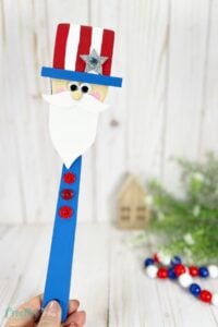 Wooden spoon Uncle Sam patriotic craft for all ages. Adds patriotic touch to celebrations. Red, white, and blue burst of fun!