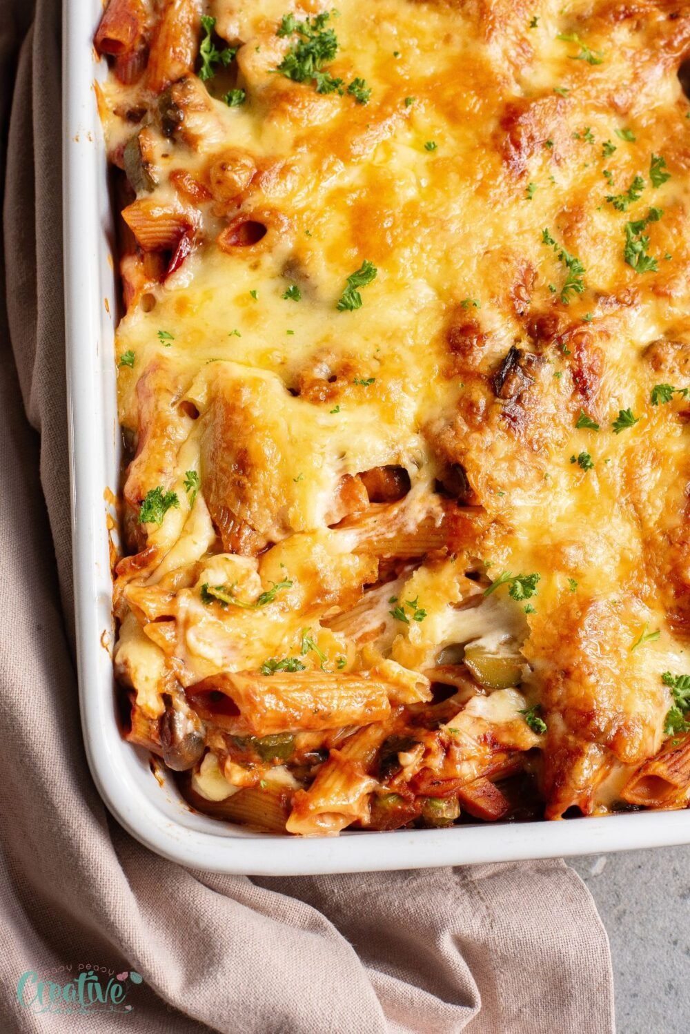 Enjoy the ultimate comfort food with a creamy baked pasta loaded with veggies, ham, and melted cheese.