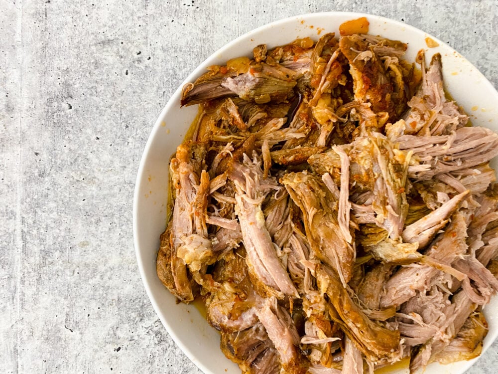 Discover the secret to irresistible slow cooker pulled pork: a tantalizing recipe featuring tender pulled pork shoulder slow-cooked to perfection.