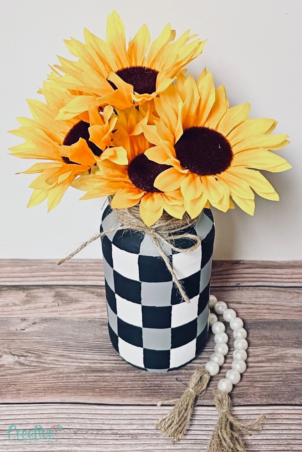 Transform your kitchen waste into a beautiful décor item with this upcycled vase project using a repurposed pasta jar.