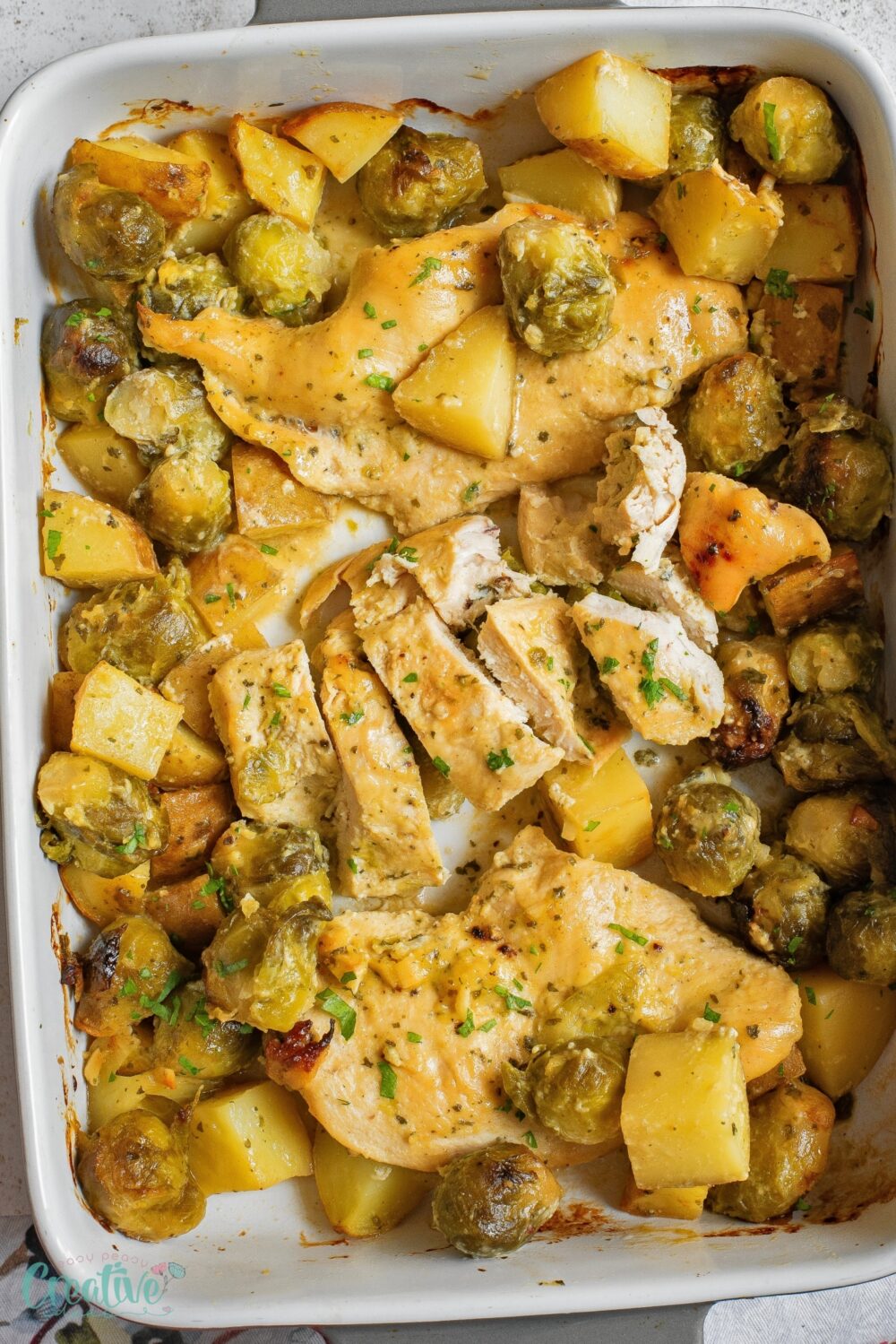 A delicious baking dish featuring chicken and Brussel sprouts in a honey and Dijon mustard sauce..