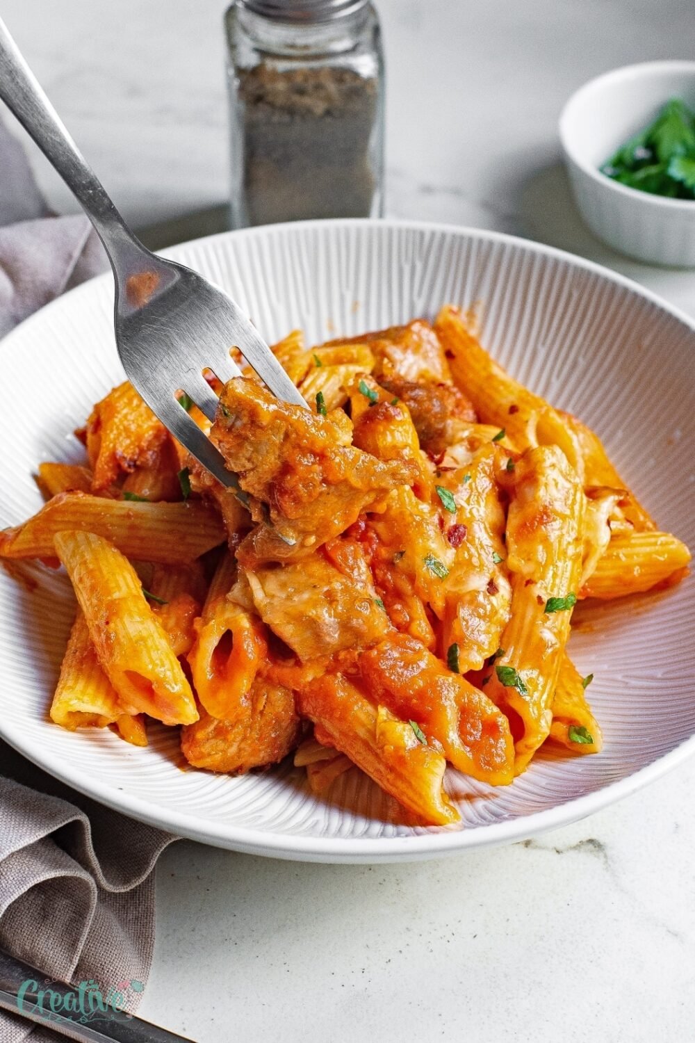 Make a delectable pasta and pork recipe that's perfect for family dinners, combining tender pork chops with savory pasta in a rich marinara sauce.