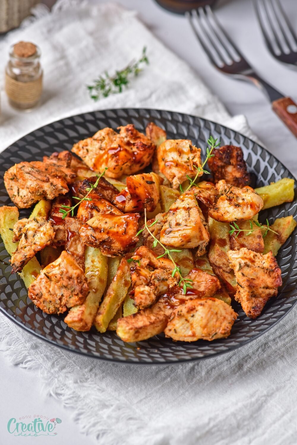 Enjoy the ultimate chicken potato dinner recipe: crispy potatoes and tender chicken, seasoned with aromatic spices and cooked in minutes using an air fryer.