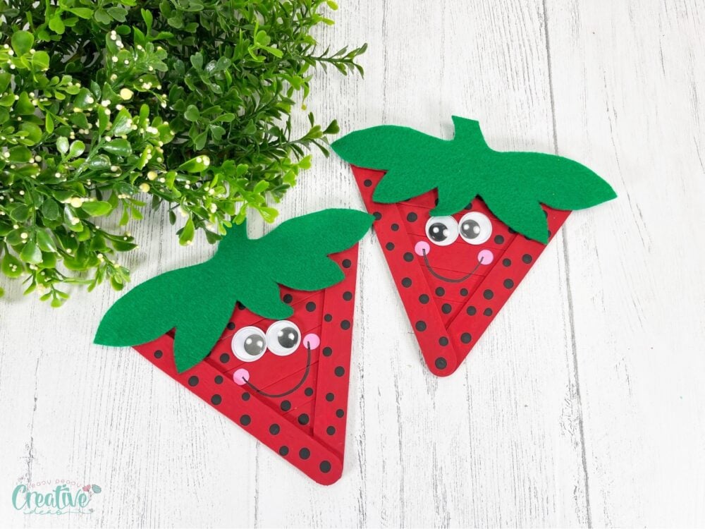 This fun and simple craft sticks strawberry is perfect summer project for kids and adults alike. Make your own whimsical strawberry craft in just minutes!