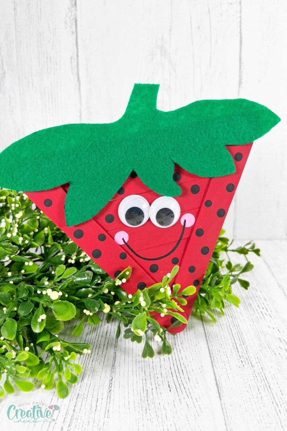 The simplicity of using jumbo craft sticks as the base structure makes this strawberry craft sturdy and easy to handle.