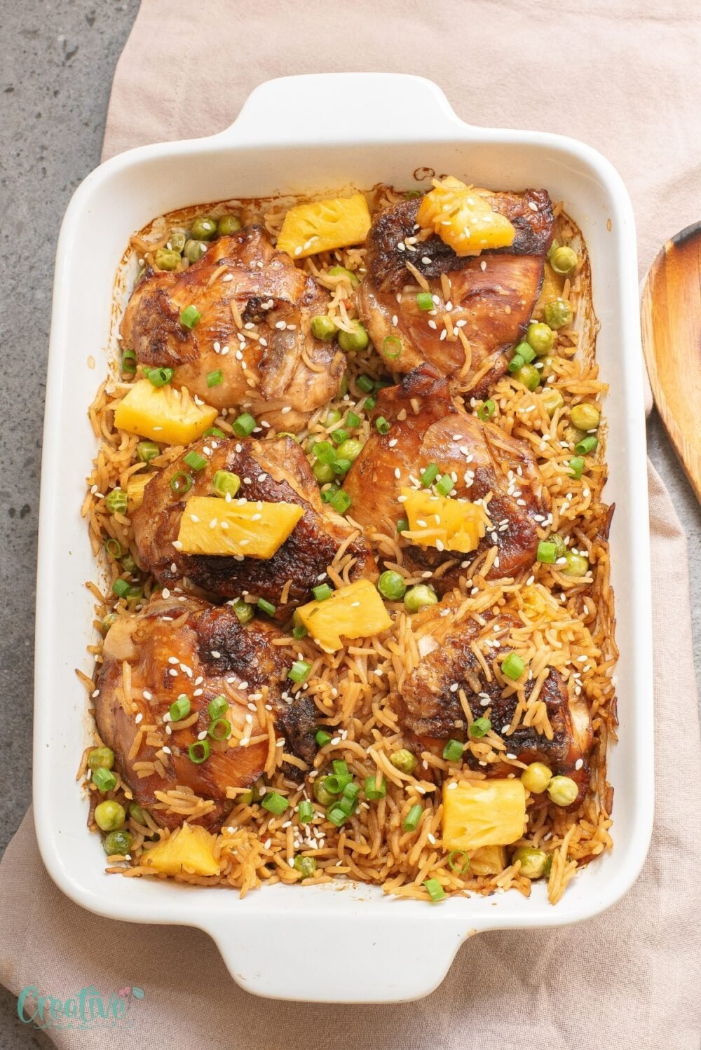 Juicy Teriyaki chicken thighs with baked pineapple rice baked to perfection - one pan dinner that’s flavorful, easy & perfect for any night of the week!